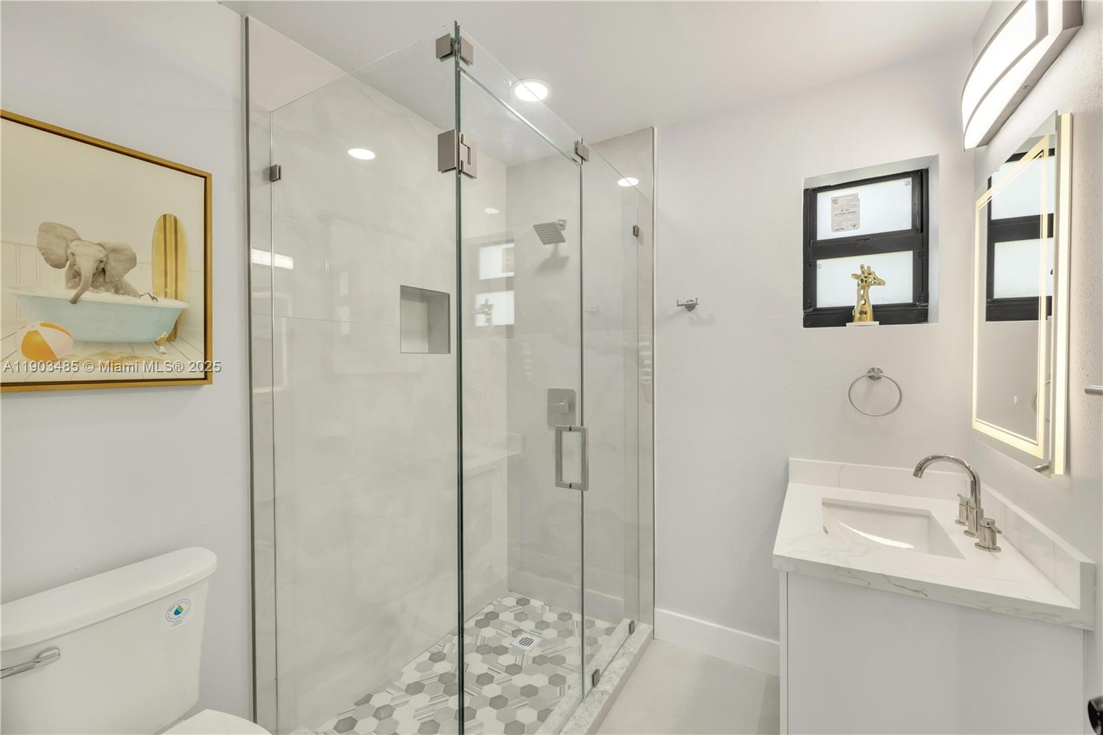 6021 Southwest 19th Street Miami, FL 33155 - Photo 6 of 20 a bathroom with a sink a toilet and shower