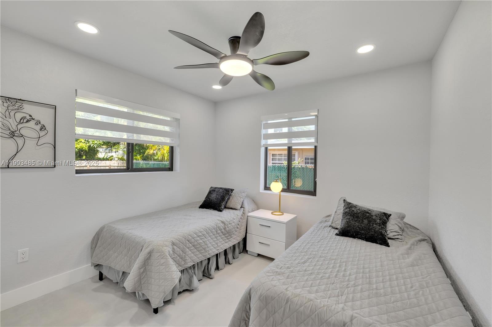 6021 Southwest 19th Street Miami, FL 33155 - Photo 10 of 20 a bedroom with a bed and a large window