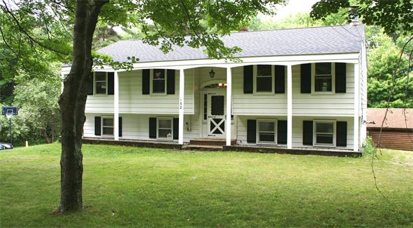 132 Union Road Wales, MA 01081 - Photo 1 of 25 a view of a house with yard and sitting area