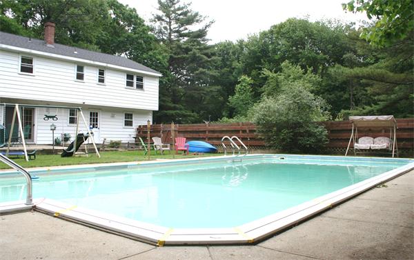 132 Union Road Wales, MA 01081 - Photo 20 of 25 a view of a house with a swimming pool and a chairs