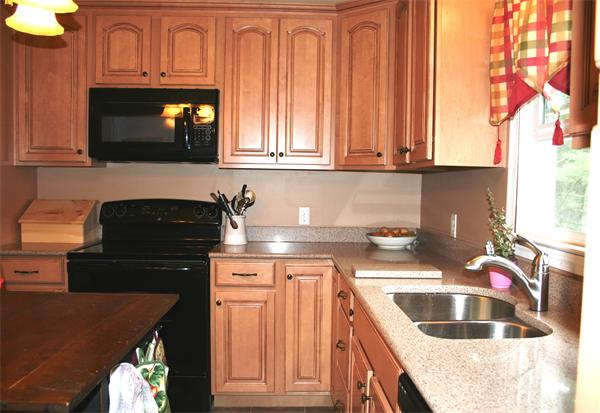 132 Union Road Wales, MA 01081 - Photo 4 of 25 a kitchen with granite countertop a sink stove and cabinets