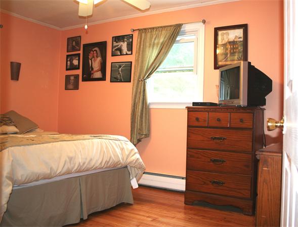 132 Union Road Wales, MA 01081 - Photo 10 of 25 a bed sitting in a bedroom next to a window