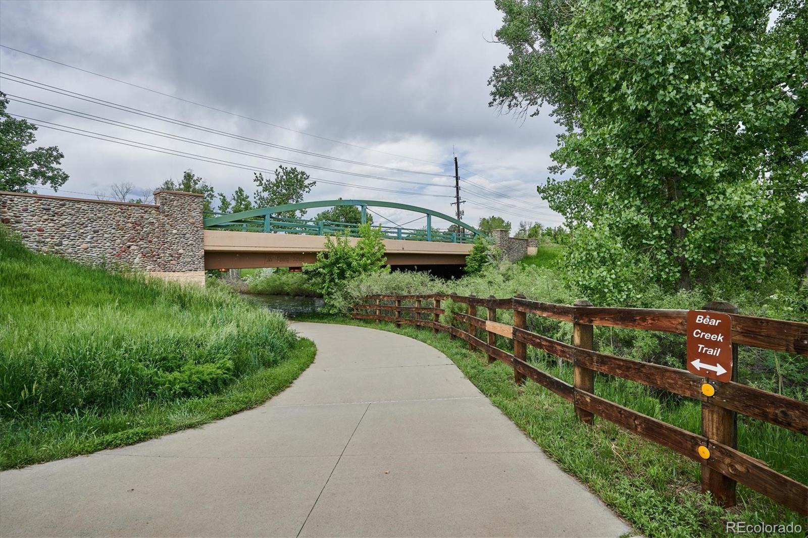 4143 South Deframe Court Morrison, CO 80465 - Photo 9 of 48 a view of a pathway both side of building with yard