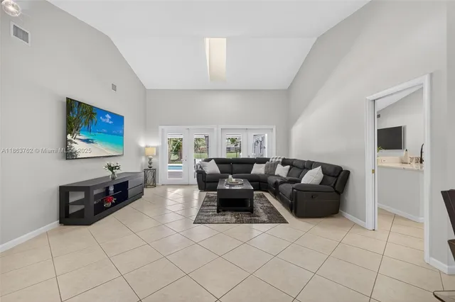 a spacious bathroom with a shower sink and mirror