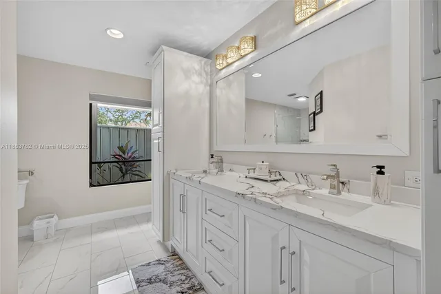 a living room with couch and a large window