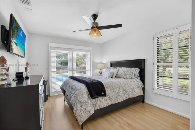 an aerial view of residential houses with outdoor space and street view
