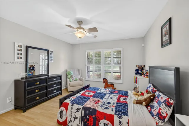 an aerial view of residential houses with outdoor space and street view