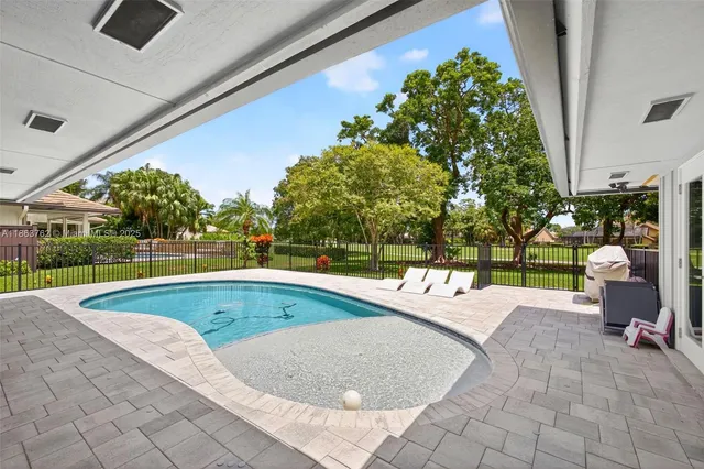 an aerial view of residential house with outdoor space and street view