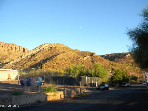 a view of a building with mountains in the background