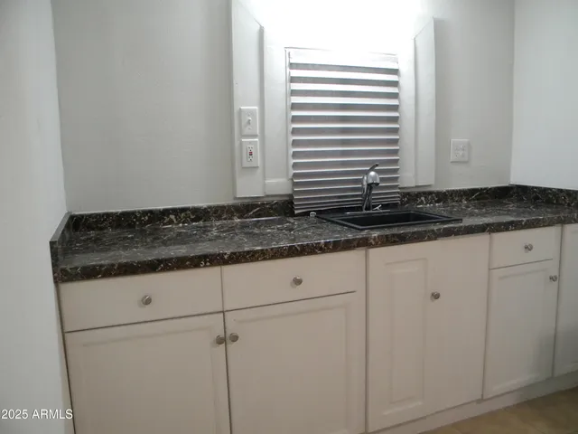 a view of a balcony with wooden floor