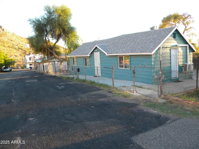 a view of house with swimming pool