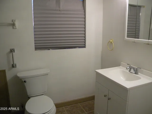 a room with a wooden floor and furniture