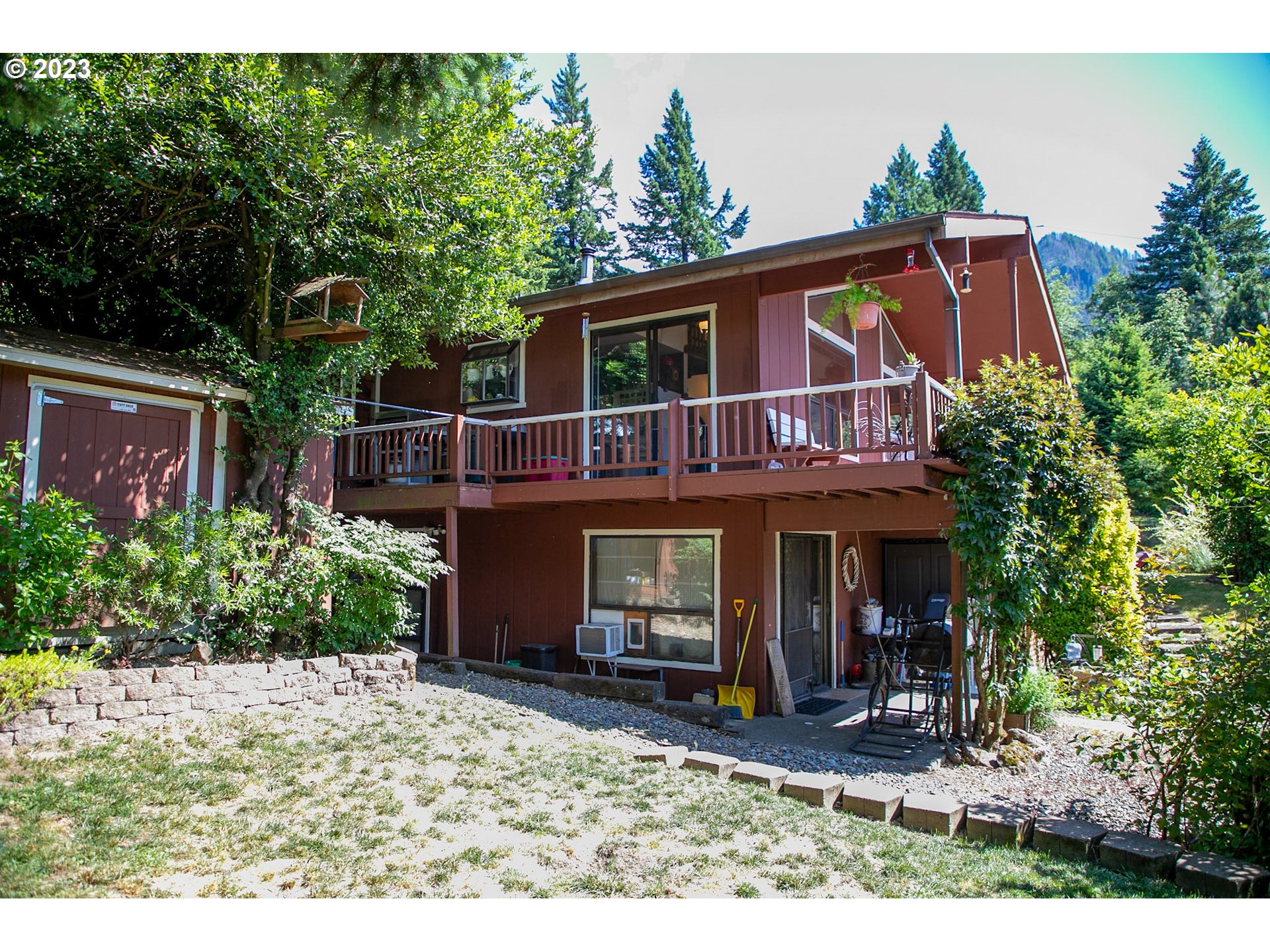 100 Southwest Wasco Street Cascade Locks, OR 97014 - Photo 6 of 21 a view of a house with backyard and sitting area