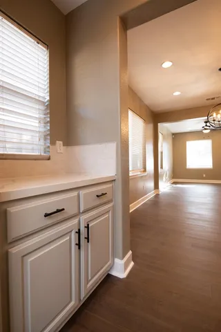 a kitchen with a sink and cabinets