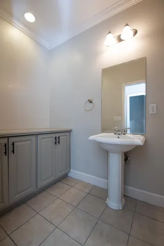 a bathroom with a sink a mirror and a toilet