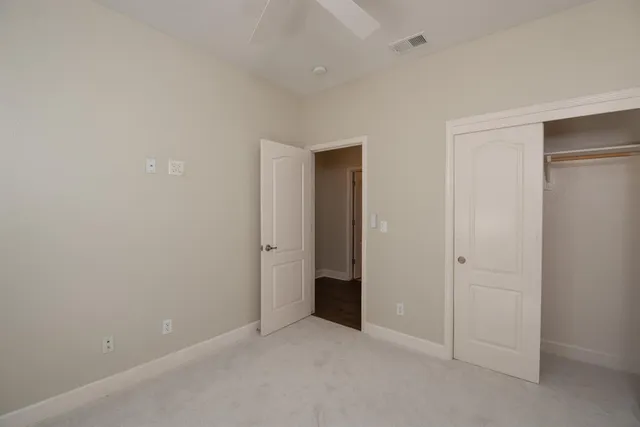 an empty room with closet area