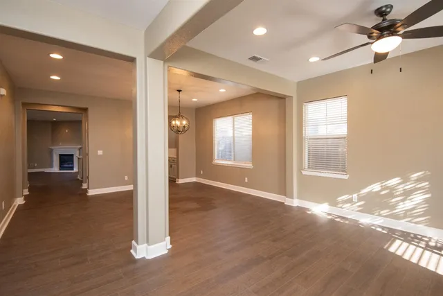 a view of livingroom with hardwood floor and a ceiling fan