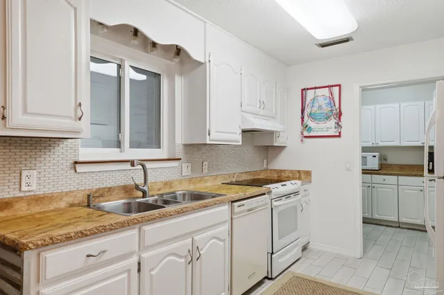 a kitchen with a sink and cabinets