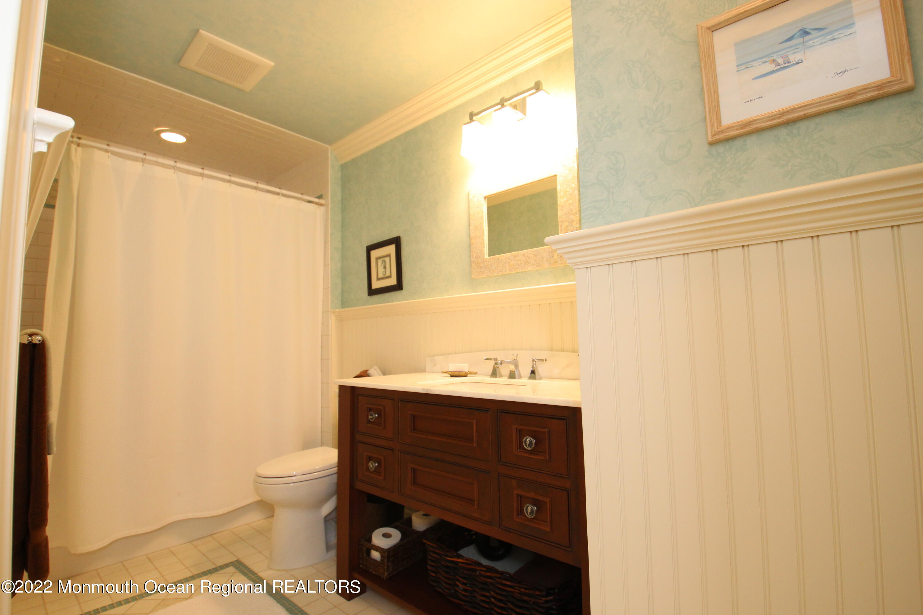106 Stockton Boulevard Sea Girt, NJ 08750 - Photo 16 of 27 a bathroom with a granite countertop sink toilet and shower