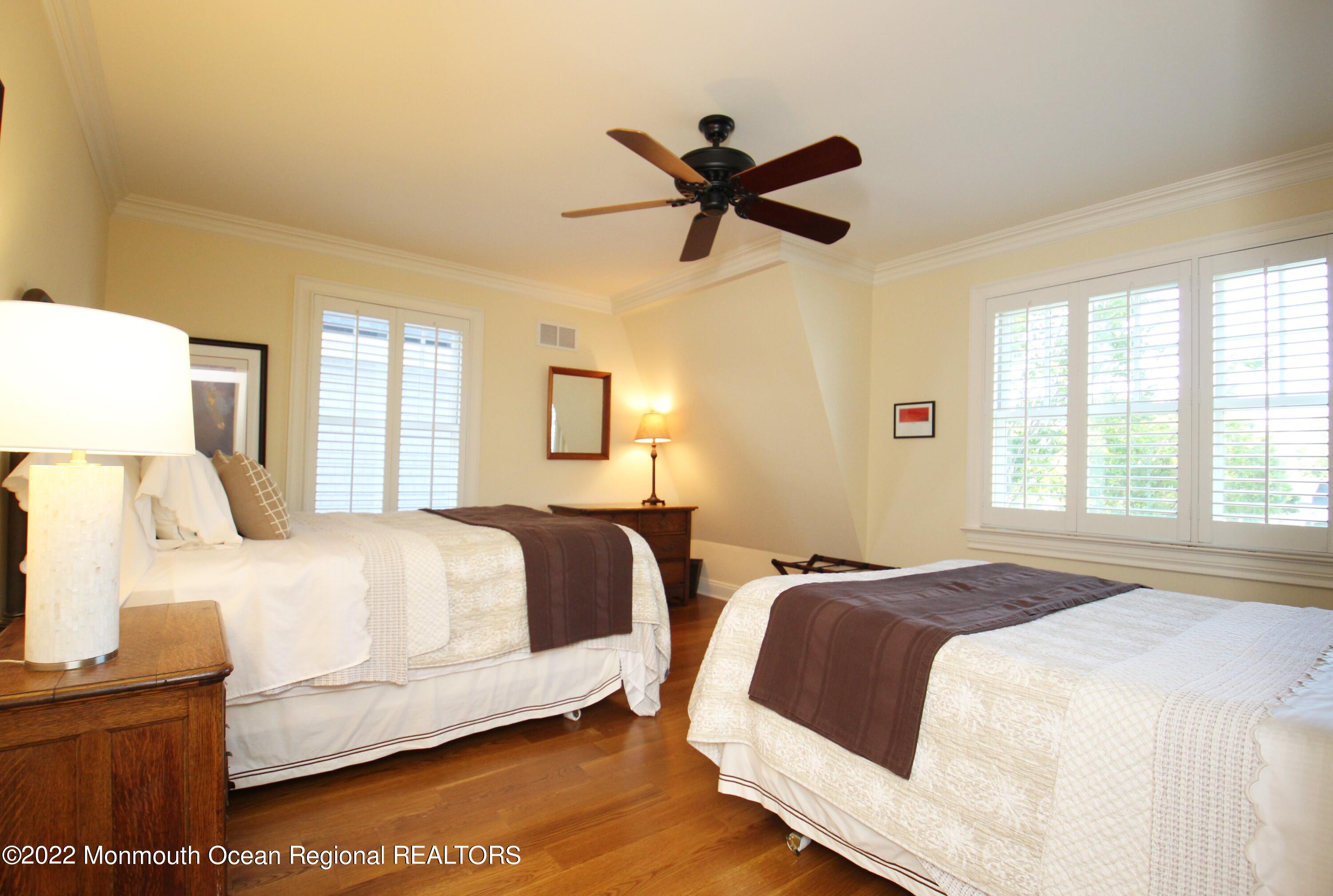 106 Stockton Boulevard Sea Girt, NJ 08750 - Photo 18 of 27 a bedroom with a bed and window