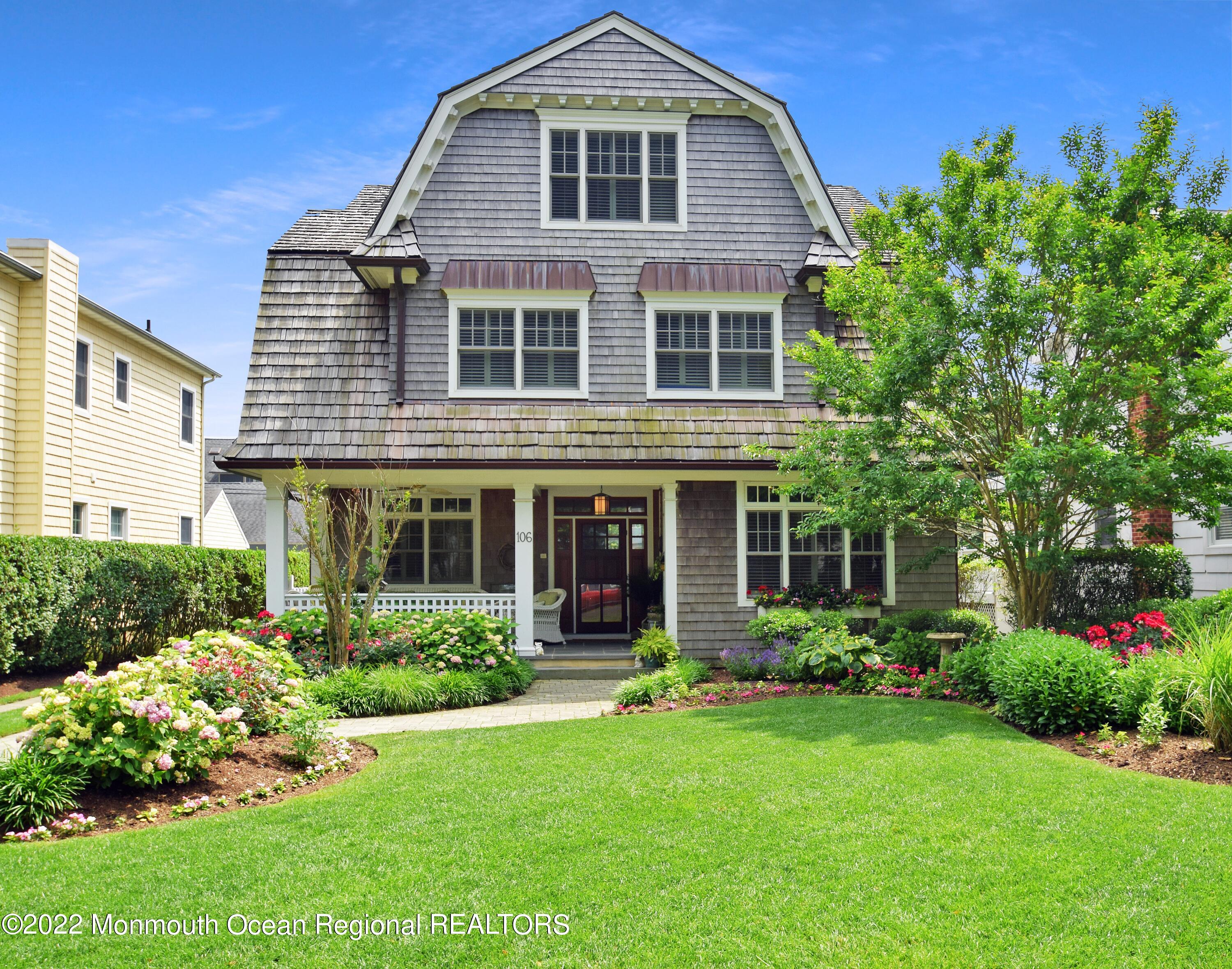 106 Stockton Boulevard Sea Girt, NJ 08750 - Photo 2 of 27 a front view of a house with garden