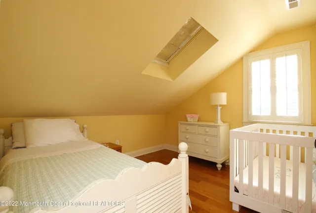 a bedroom with a bed and cabinets