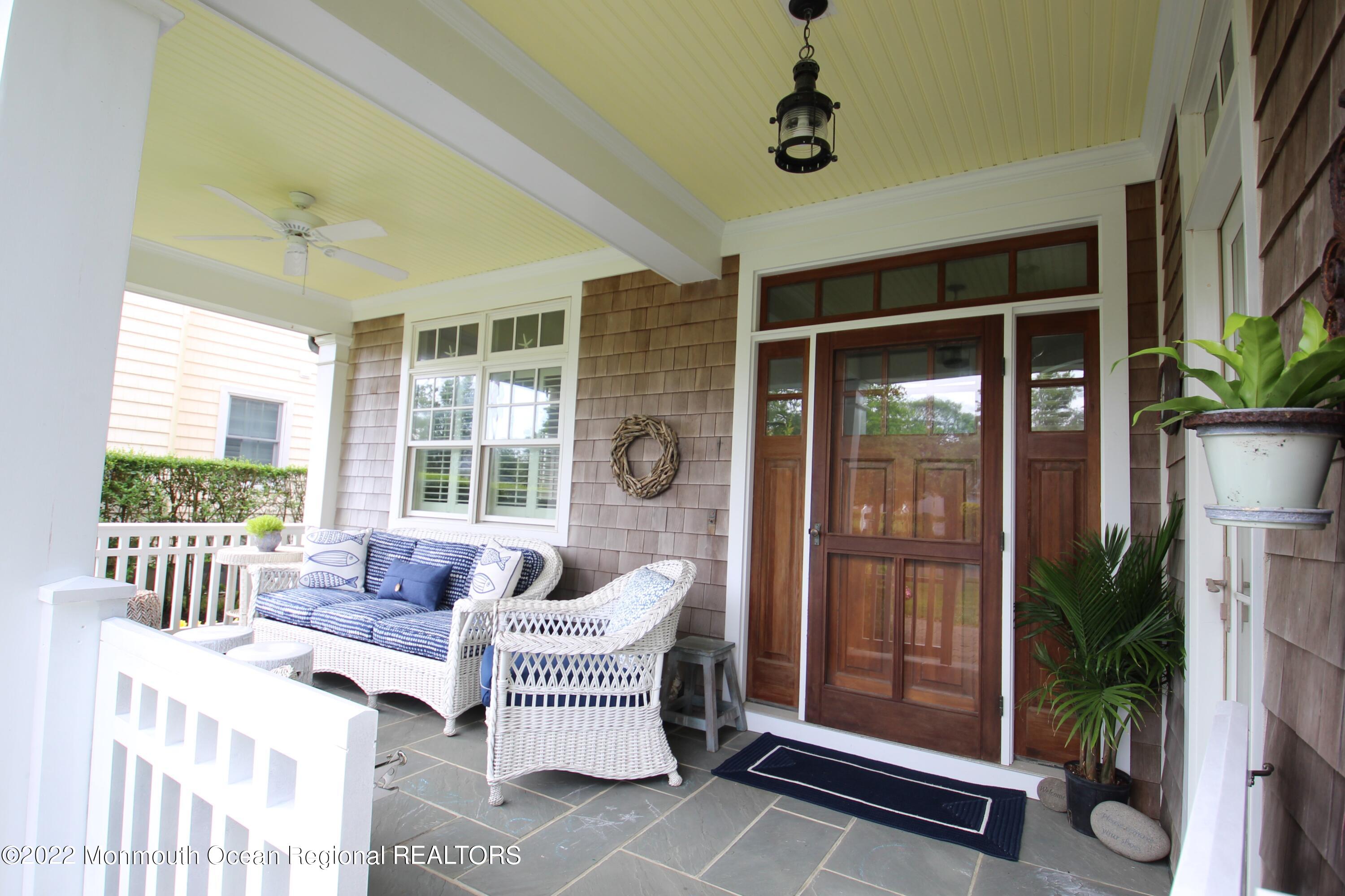 106 Stockton Boulevard Sea Girt, NJ 08750 - Photo 4 of 27 a living room with furniture and a window