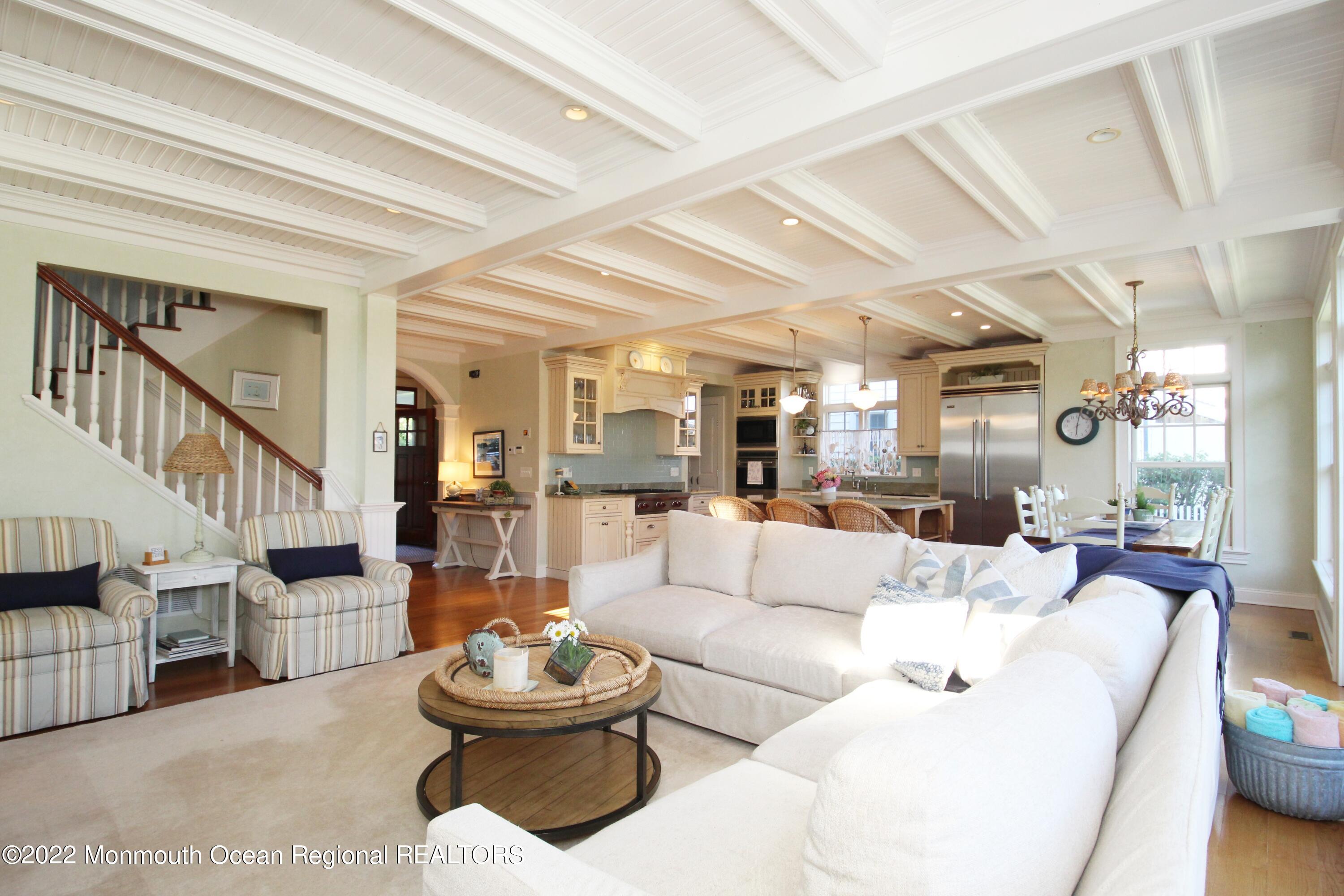 106 Stockton Boulevard Sea Girt, NJ 08750 - Photo 6 of 27 a living room with furniture and a dining table