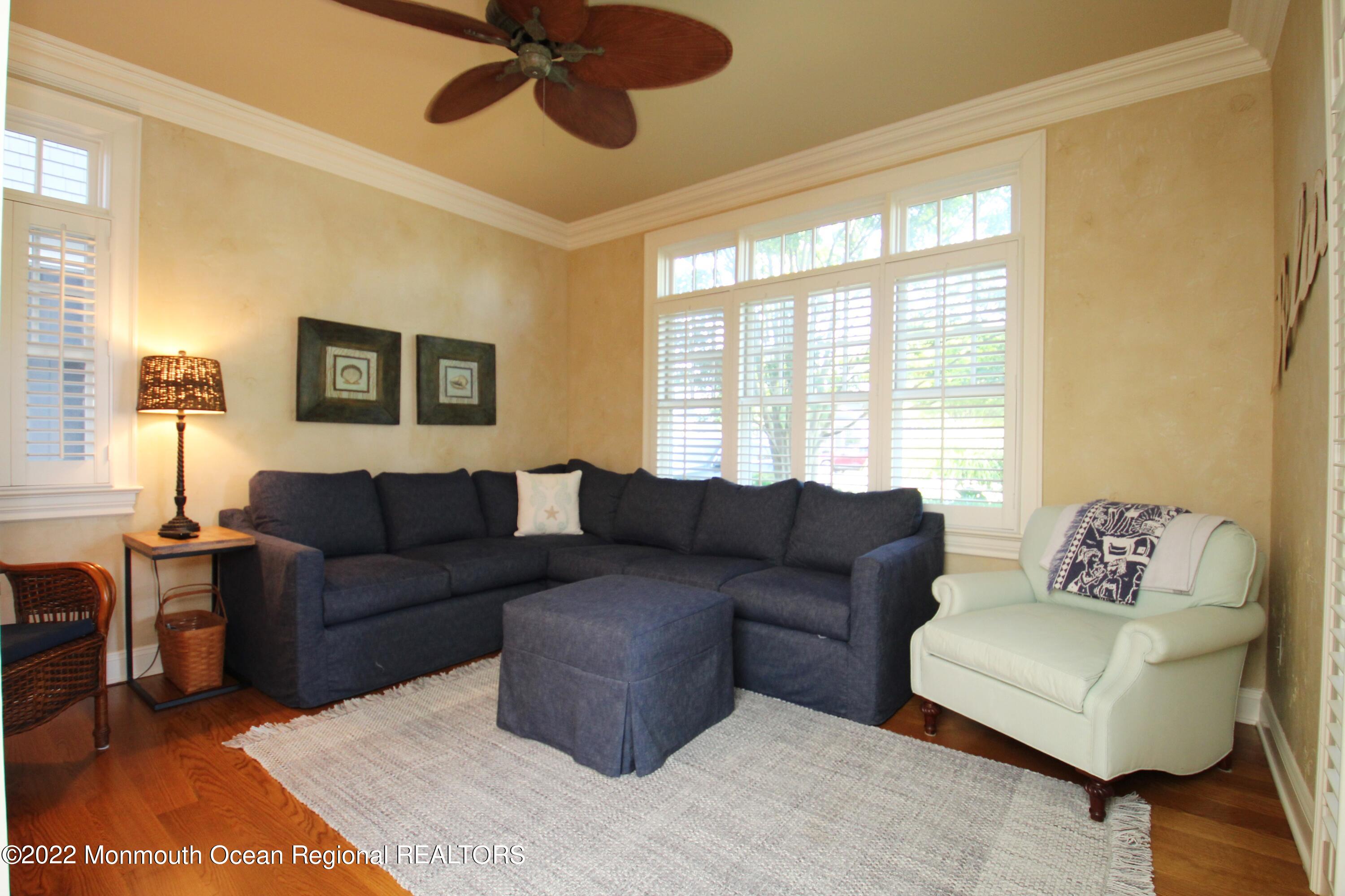 106 Stockton Boulevard Sea Girt, NJ 08750 - Photo 9 of 27 a living room with furniture and a window