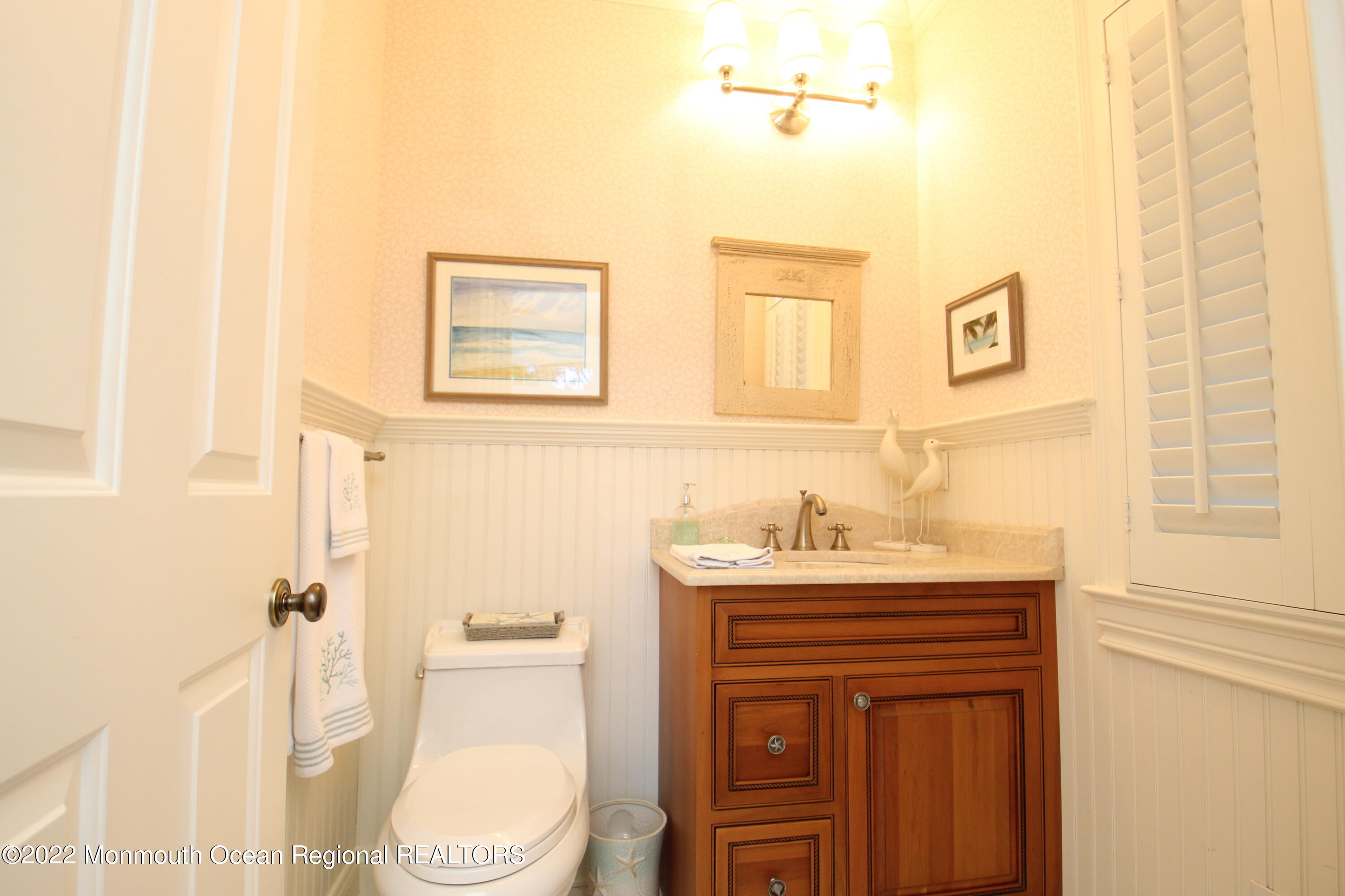 106 Stockton Boulevard Sea Girt, NJ 08750 - Photo 10 of 27 a bathroom with a sink a toilet and shower
