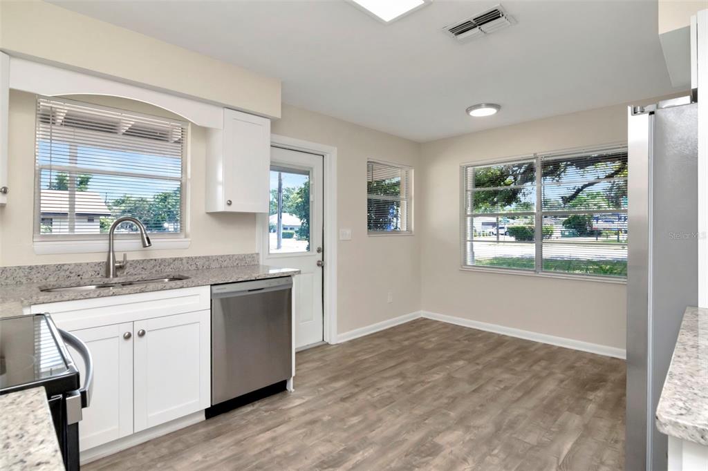 126 Kingsway Road Brandon, FL 33510 - Photo 16 of 42 a kitchen with a sink cabinets and window