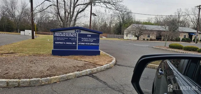 a view of a house with a snow on the road
