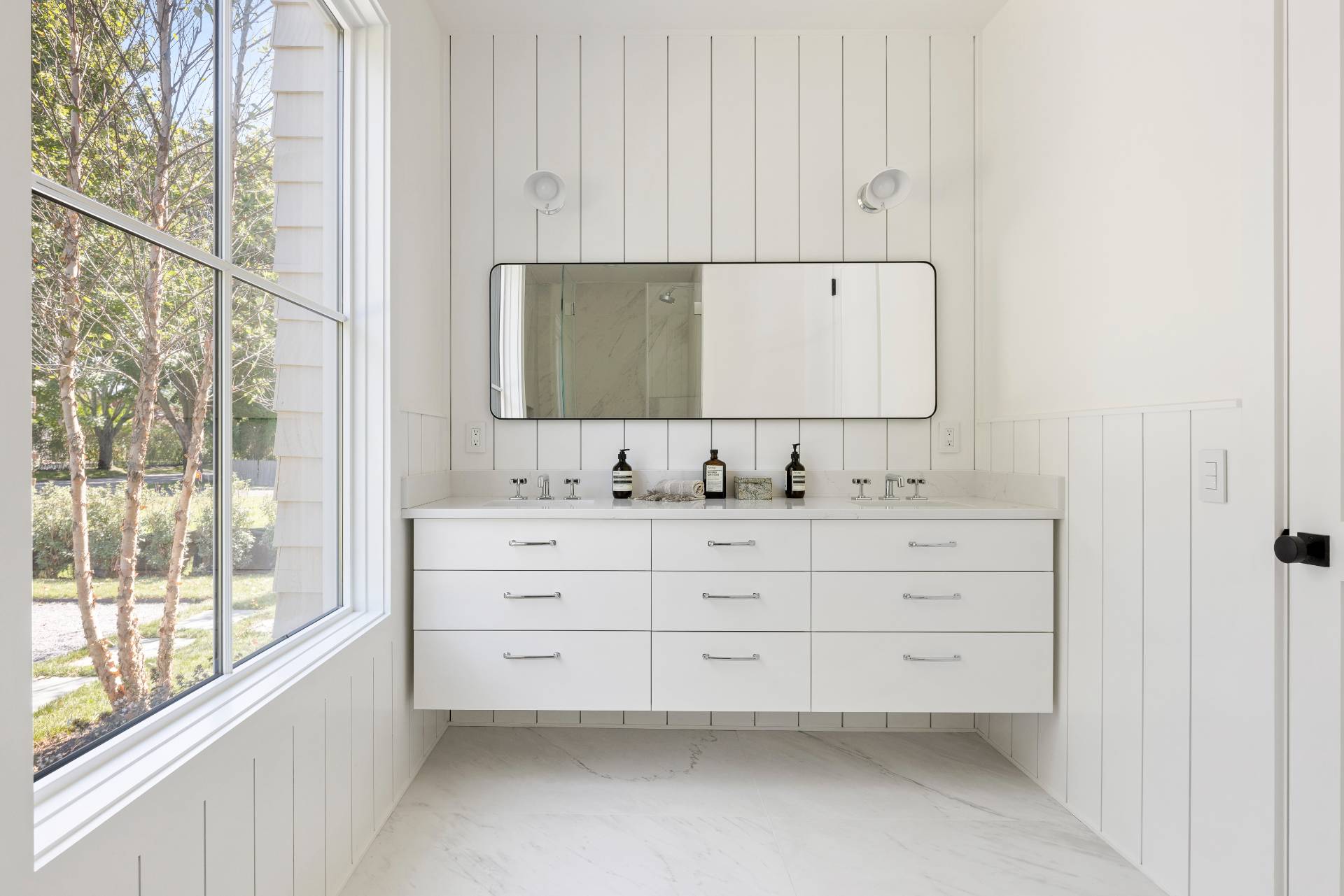 222 White Street Southampton, NY 11968 - Photo 11 of 28 a bathroom with a sink and a mirror
