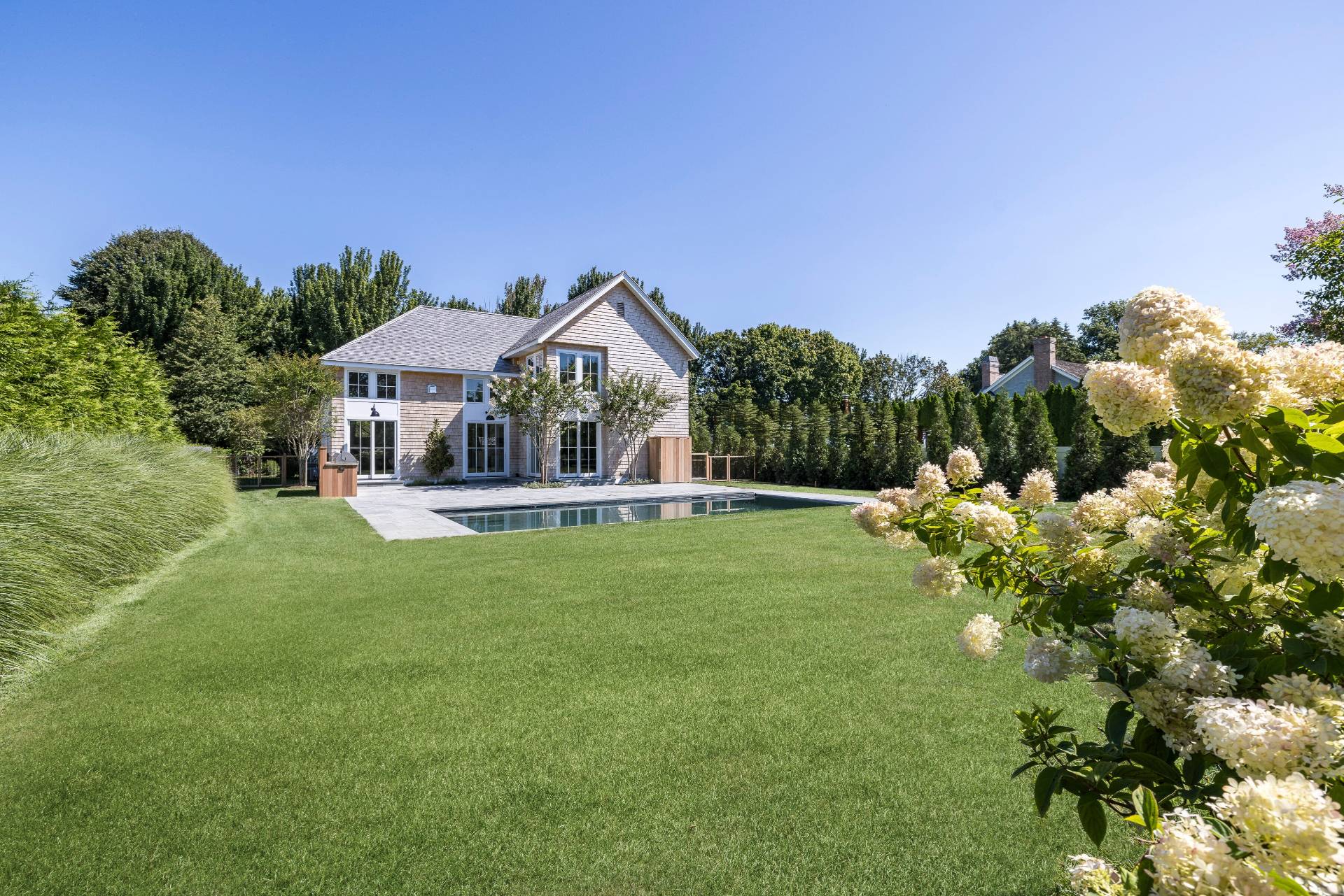 222 White Street Southampton, NY 11968 - Photo 2 of 28 a front view of a house with garden