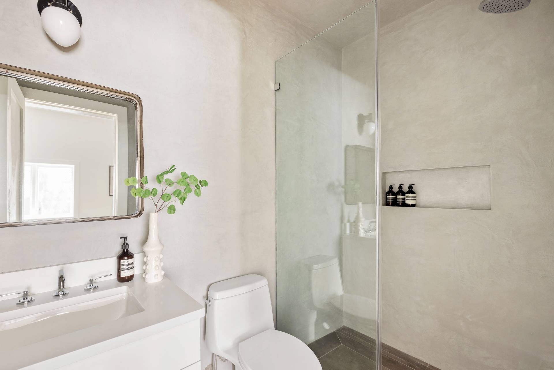222 White Street Southampton, NY 11968 - Photo 23 of 28 a bathroom with a granite countertop sink toilet and shower
