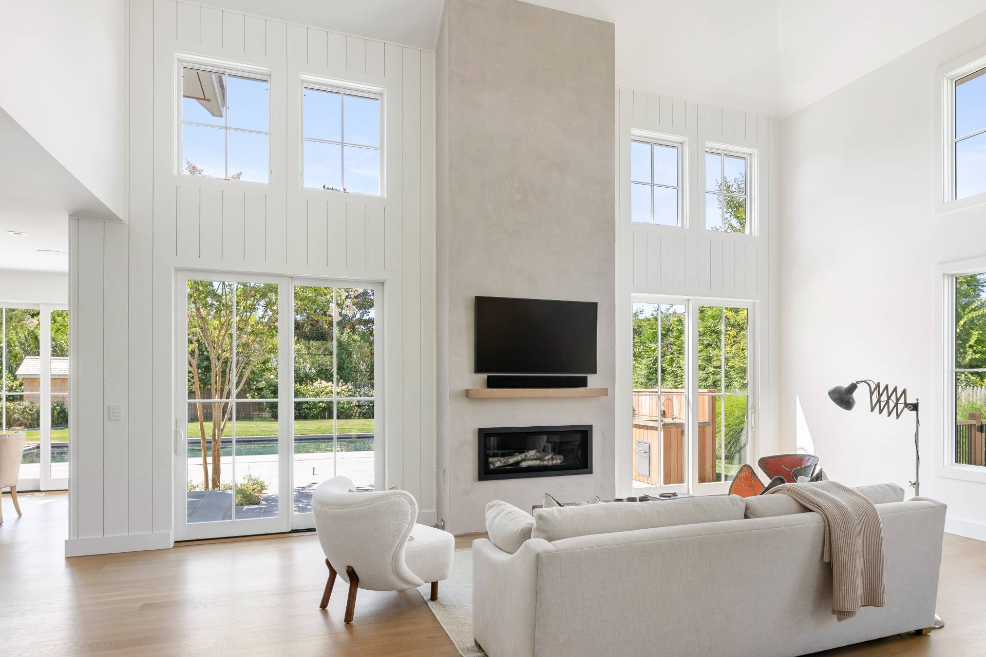 222 White Street Southampton, NY 11968 - Photo 3 of 28 a living room with fireplace furniture and a flat screen tv