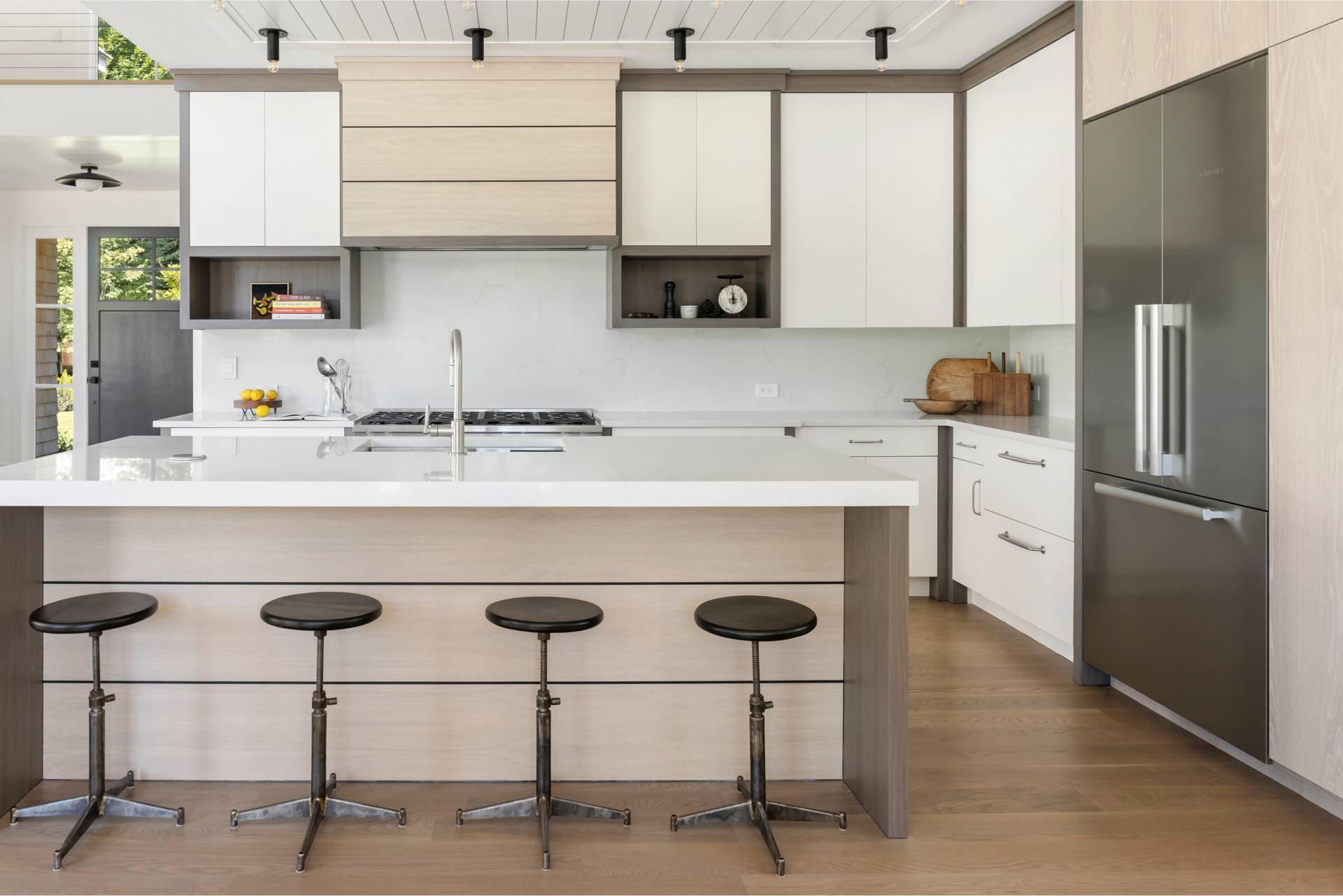 222 White Street Southampton, NY 11968 - Photo 5 of 28 a kitchen with stainless steel appliances granite countertop a sink a stove a refrigerator a counter top space and cabinets