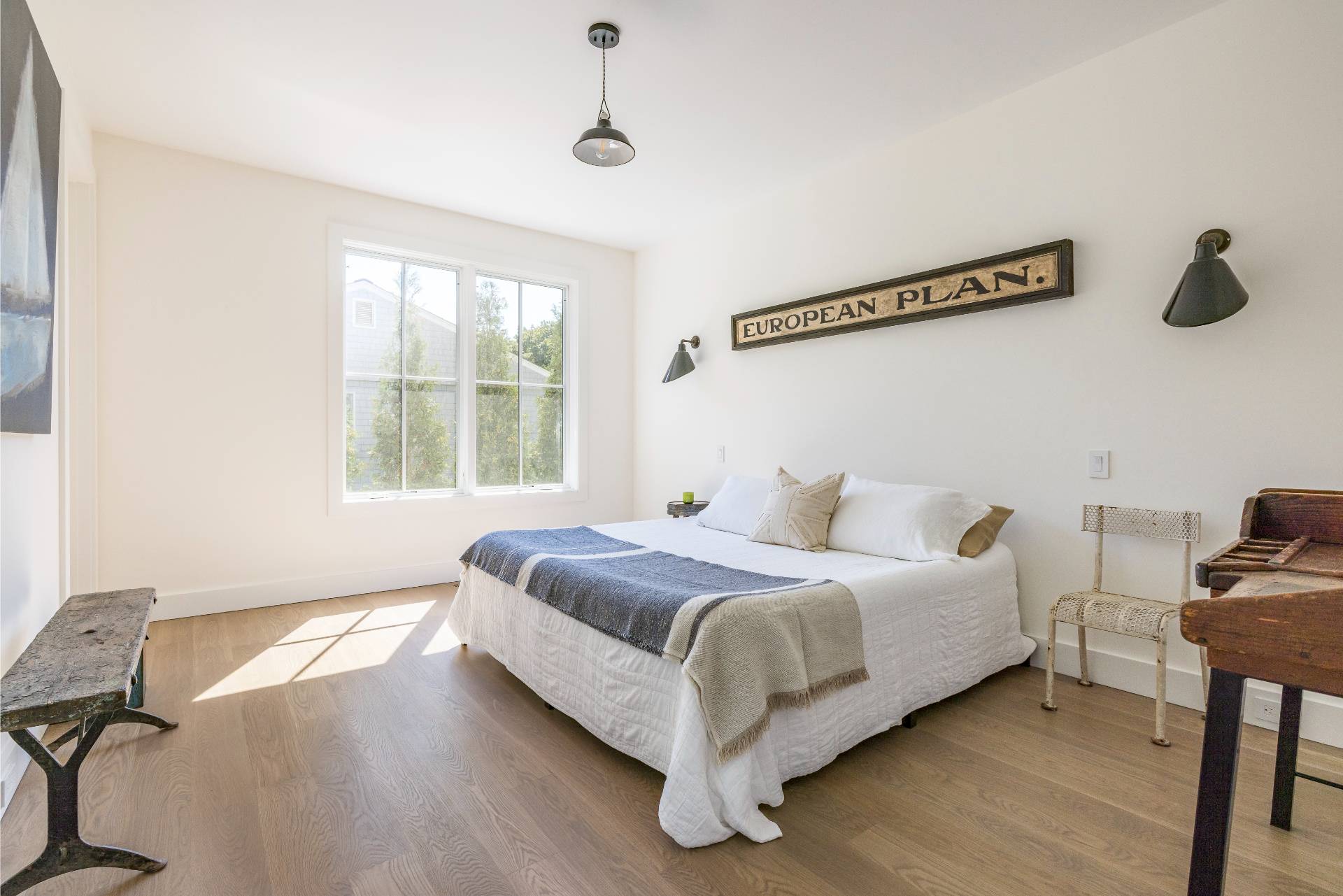 222 White Street Southampton, NY 11968 - Photo 10 of 28 a bed room with a bed and a chair