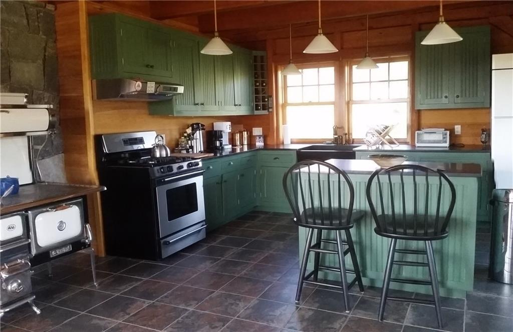 332 City Pond Road Dallas Plt, ME 04970 - Photo 4 of 32 Kitchen includes a wood cook stove...
