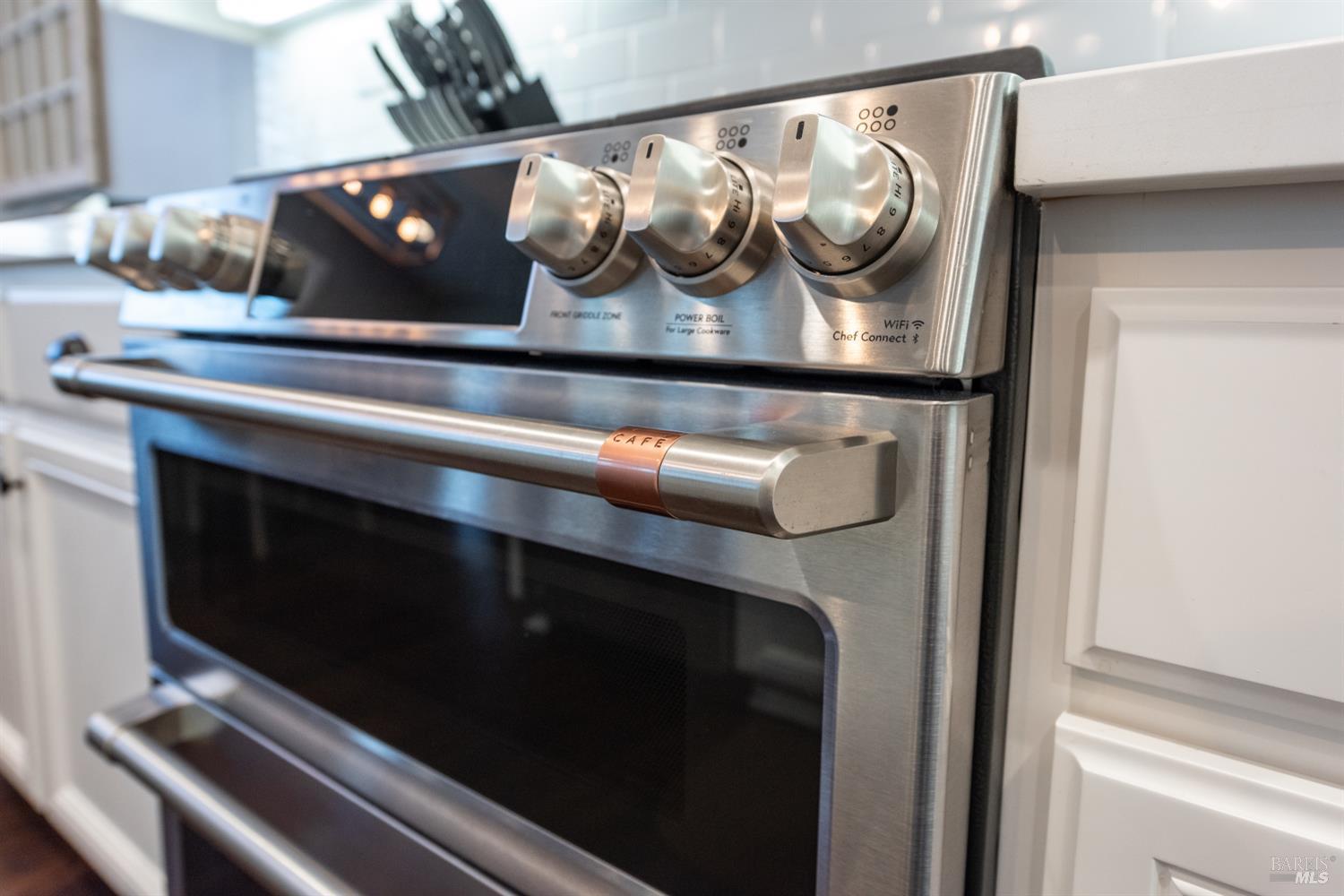 5453 Kaitlyn Place Rohnert Park, CA 94928 - Photo 5 of 41 Cook like a pro with a six-burner stove, a Cafe double oven, and a high-performance Viking refrigerator