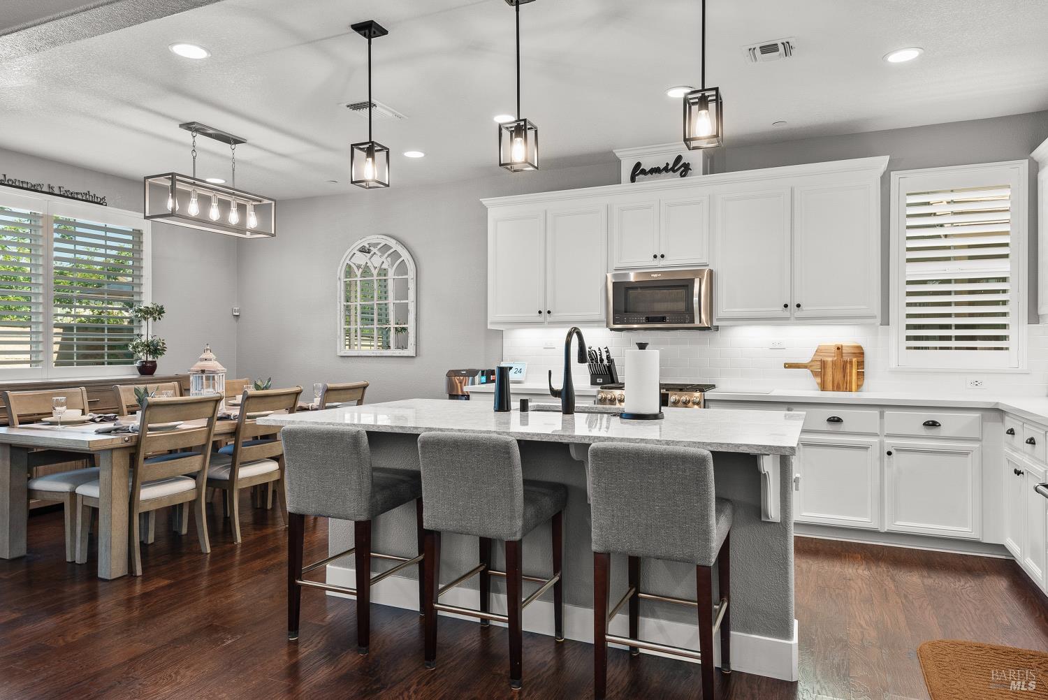 5453 Kaitlyn Place Rohnert Park, CA 94928 - Photo 7 of 41 Crisp white cabinetry paired with sleek black hardware and elegant plantation shutters creates a timeless, light-filled aesthetic.