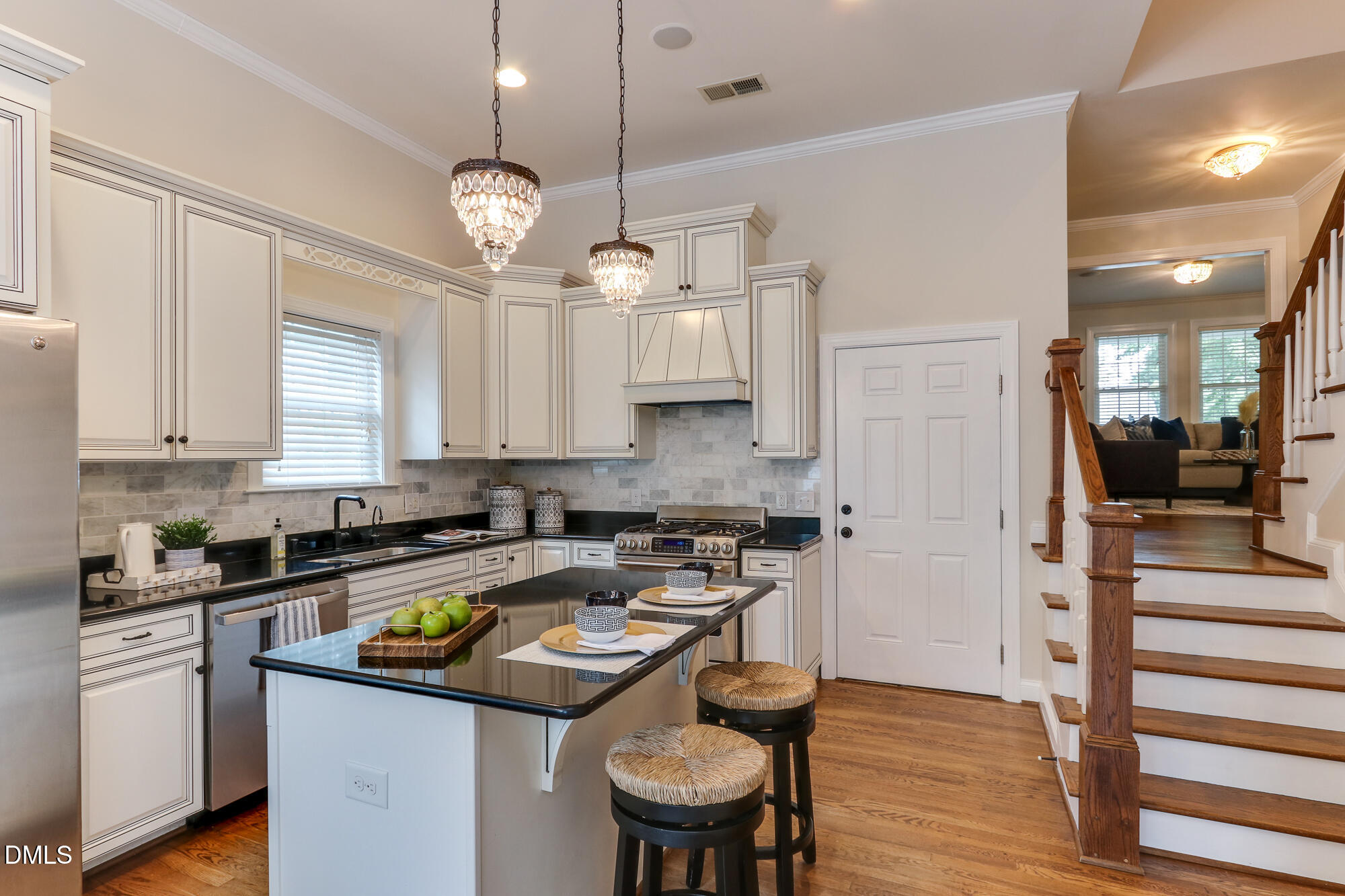 604 Mills Street Raleigh, NC 27608 - Photo 11 of 39 a kitchen with a sink a counter space appliances and cabinets