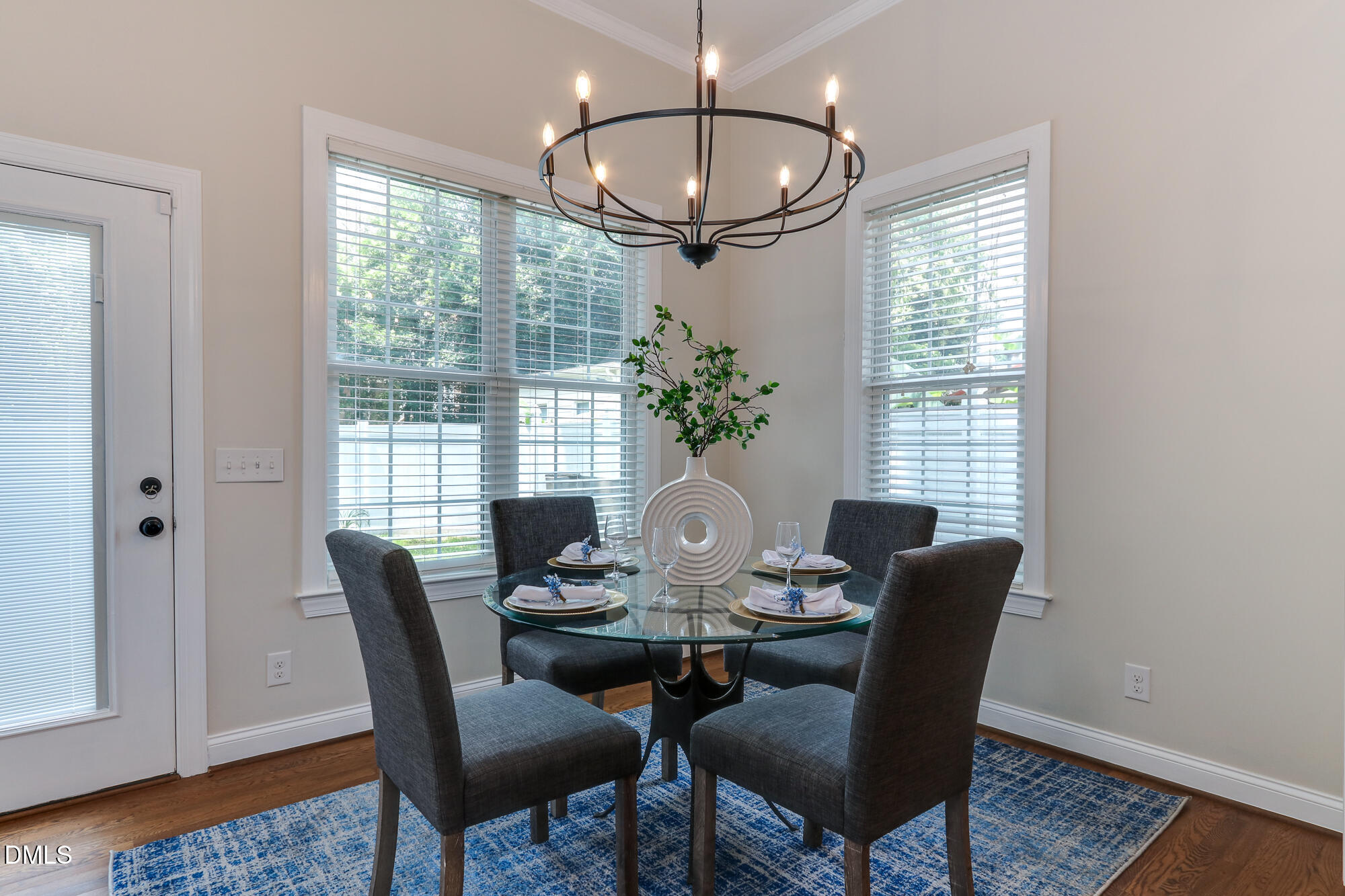 604 Mills Street Raleigh, NC 27608 - Photo 14 of 39 a view of a dining room with furniture window and wooden floor