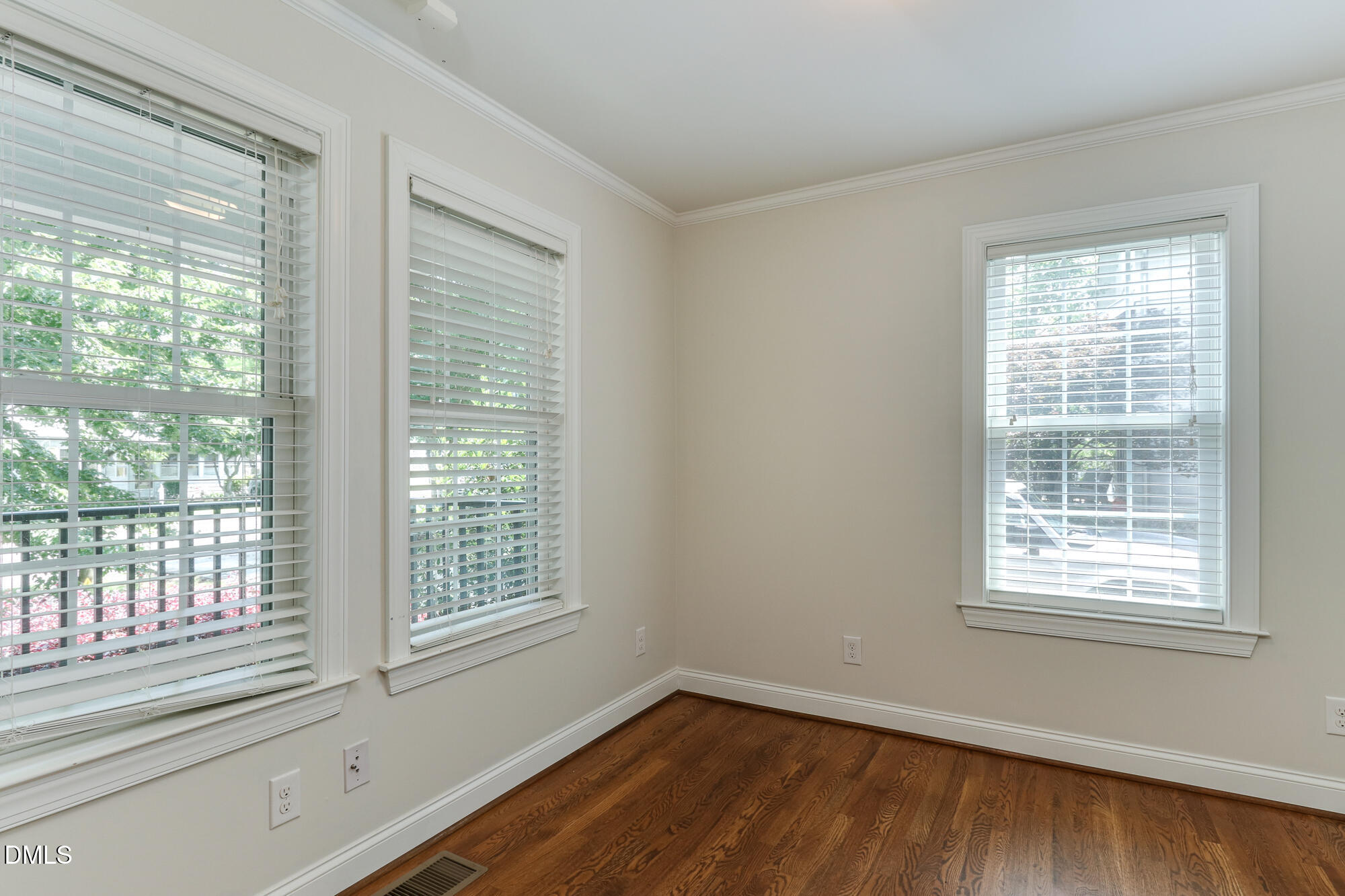 604 Mills Street Raleigh, NC 27608 - Photo 21 of 39 a view of an empty room with wooden floor and a window