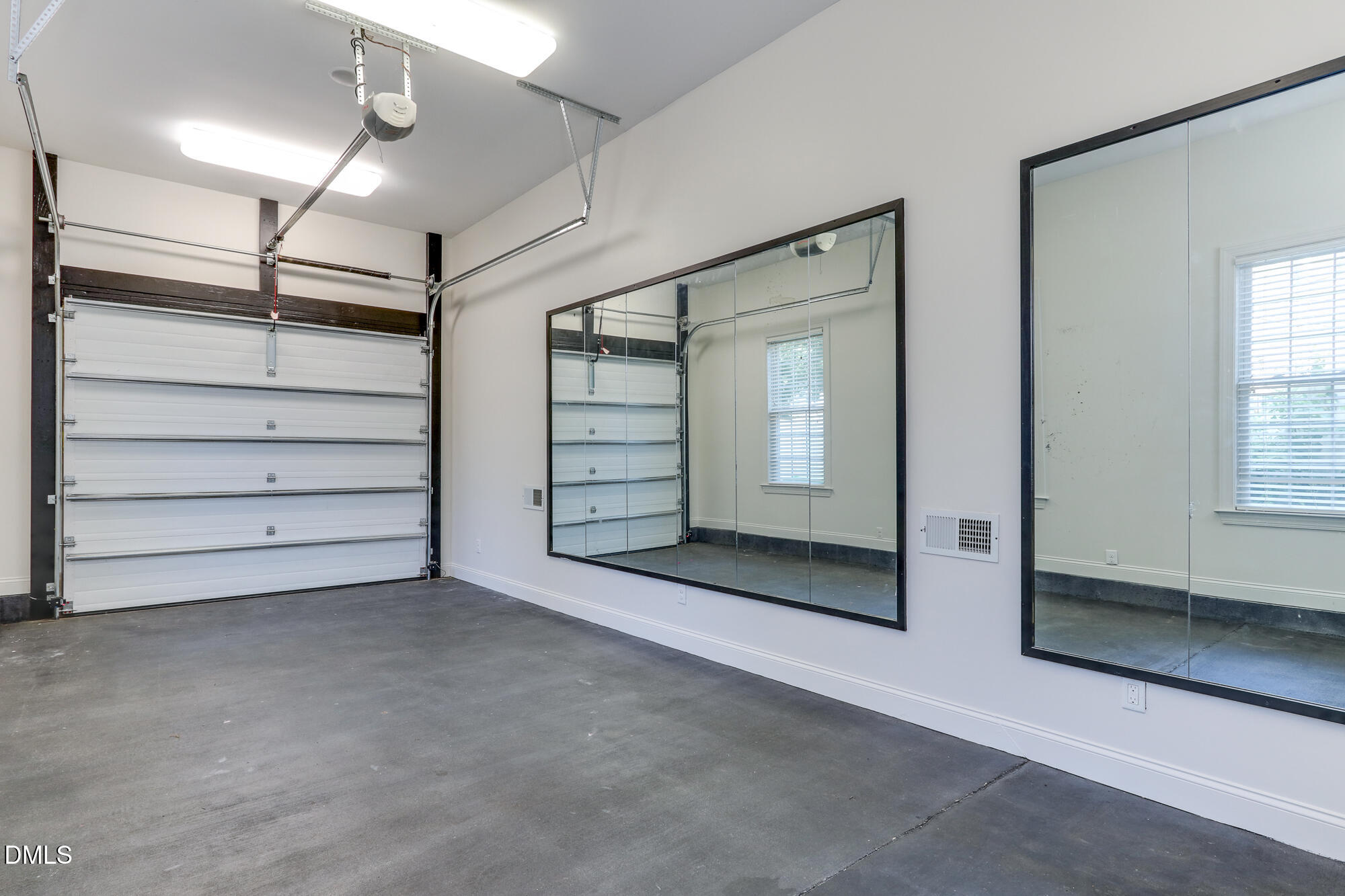 604 Mills Street Raleigh, NC 27608 - Photo 31 of 39 an empty room with windows and closet