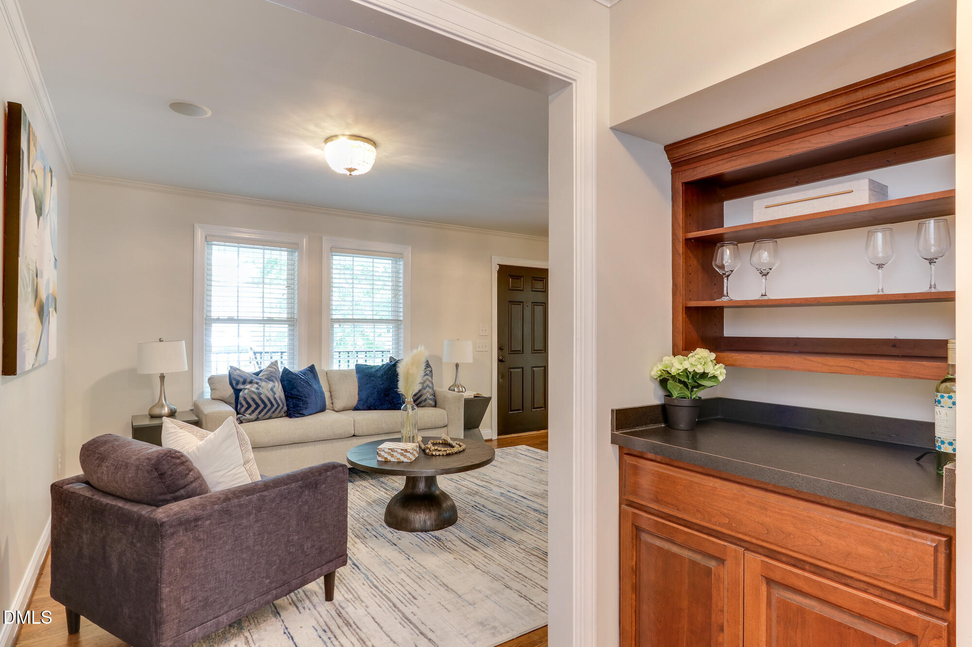 604 Mills Street Raleigh, NC 27608 - Photo 9 of 39 a living room with furniture and a potted plant