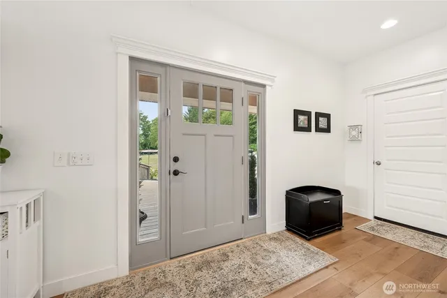 a view of livingroom with furniture and front door