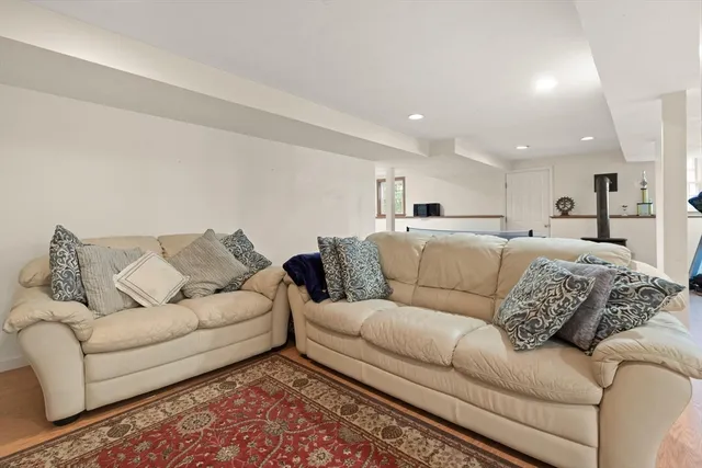 a living room with furniture white walls and a couch