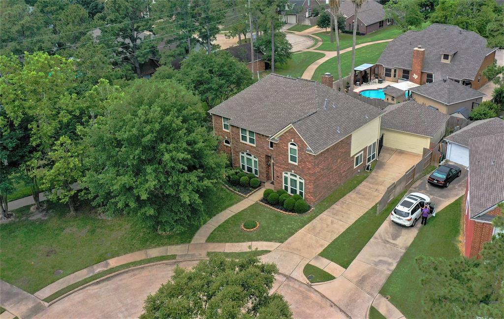 This overhead view from the front shows the long driveway leading to the detached 2-car garage. There is a lot of room for guests to park either using the driveway or the cul-de-sac. The walking path passes right beside your home and makes it easy to get anywhere in the neighborhood by bike or walking.