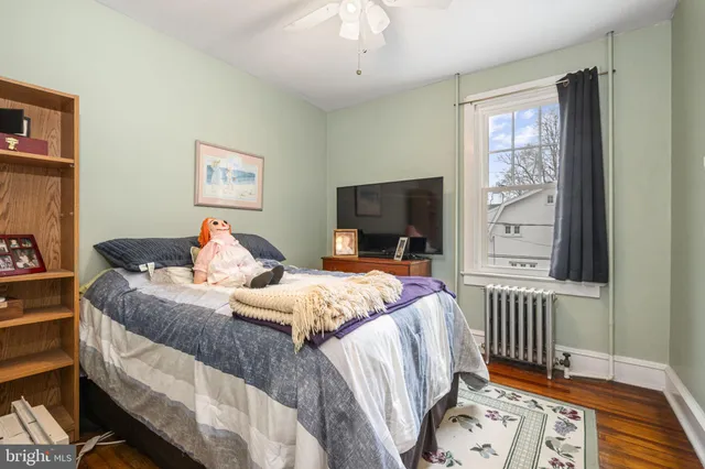 a bed room with a bed and a window